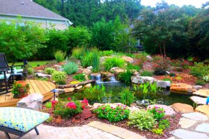 Pond Renovation Project in Charlotte Featuring New Waterfall and Stone Edging